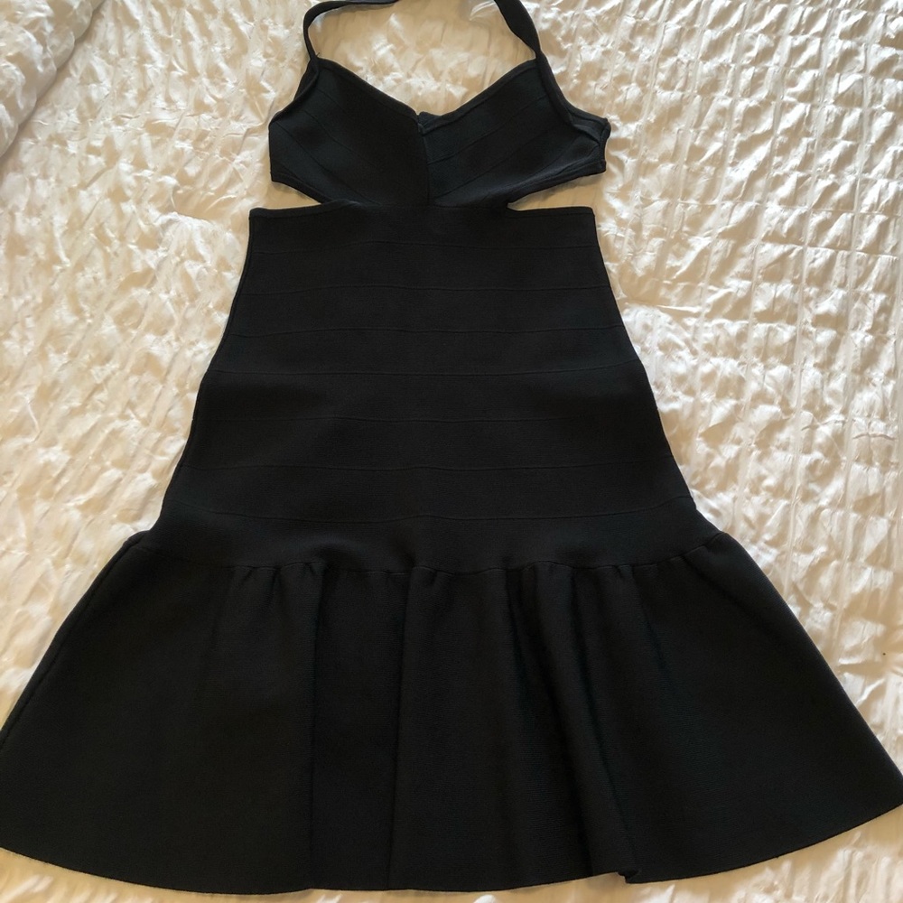 Guess Medium size black cocktail dress. Stretchy material.